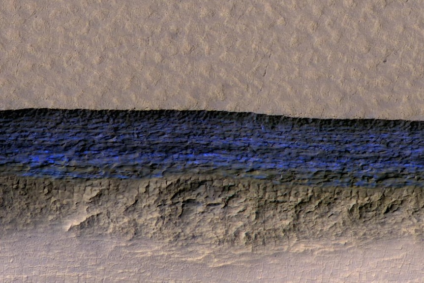 An aerial view of an ice deposit discovered on Mars, marked in blue.