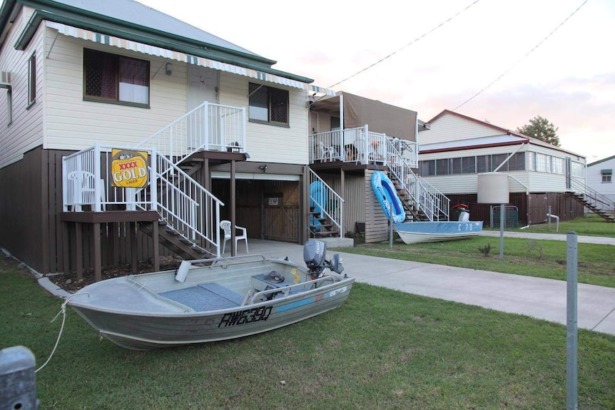 Tinnies tied up outside homes in Rockhampton's flood zone