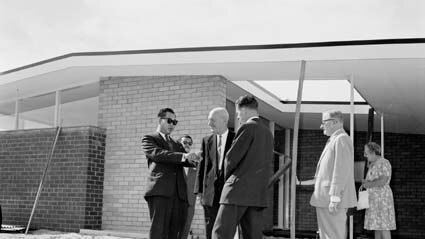 The Sultan of Selangor and his wife, Tengku Ampuan, visit a games village house in 1962.