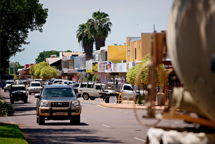Traffic drives down the main street of Katherine.