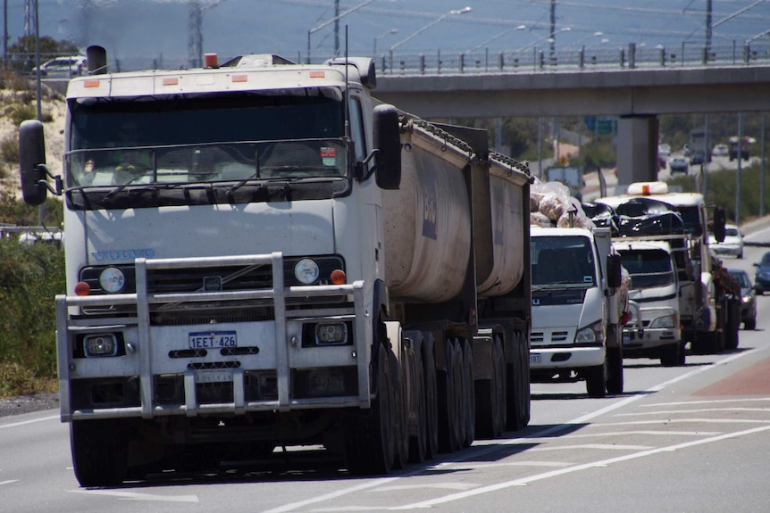 BGC heavy haulage truck is followed by other vehicles on Roe Highway.