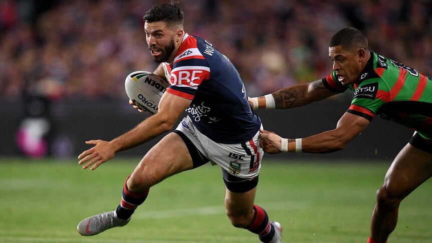 James Tedesco of the Roosters is tackled by Dane Gagai of Rabbitohs in the NRL preliminary final.