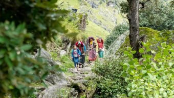 Devi leads the way on the path home to Humla.