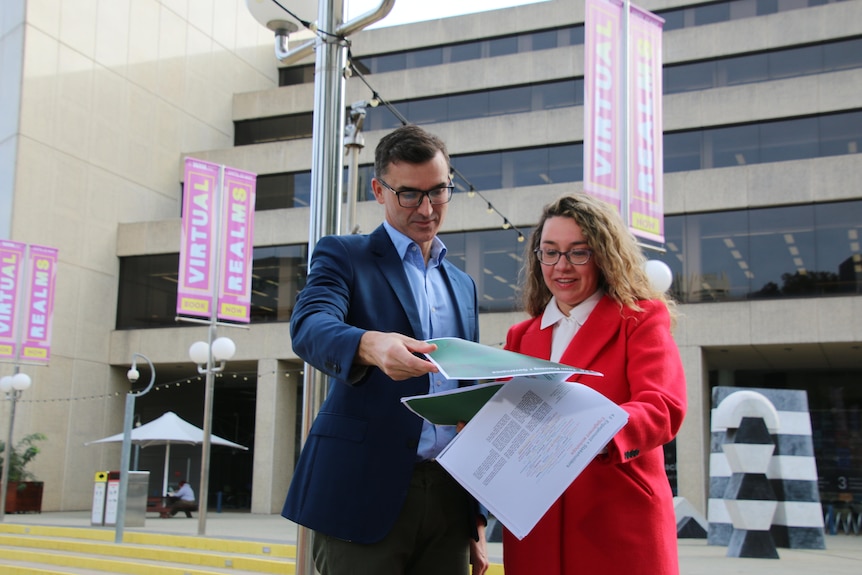 John Carey and Jessica Shaw look over the plans for the Perth Cultural Centre