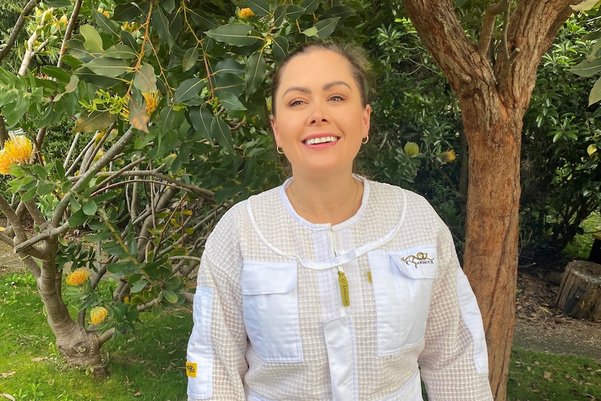 woman standing in bee suit