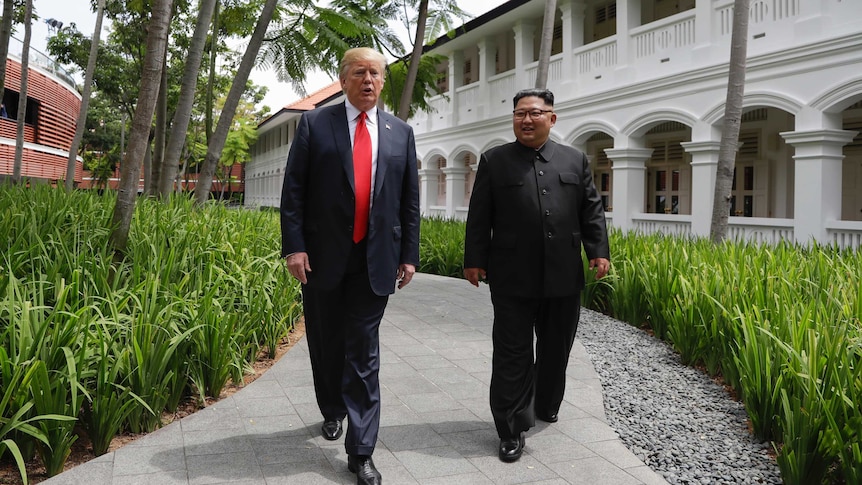 US President Donald Trump and North Korea leader Kim Jong Un walk from their lunch.