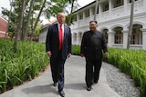 US President Donald Trump and North Korea leader Kim Jong Un walk from their lunch.