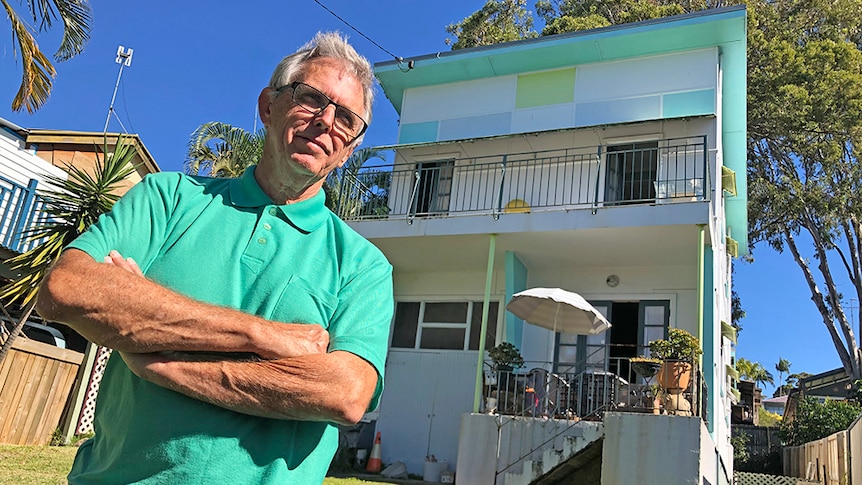 Architect Philip Follent standing outside heritage protected home at Tugun on the Gold Coast