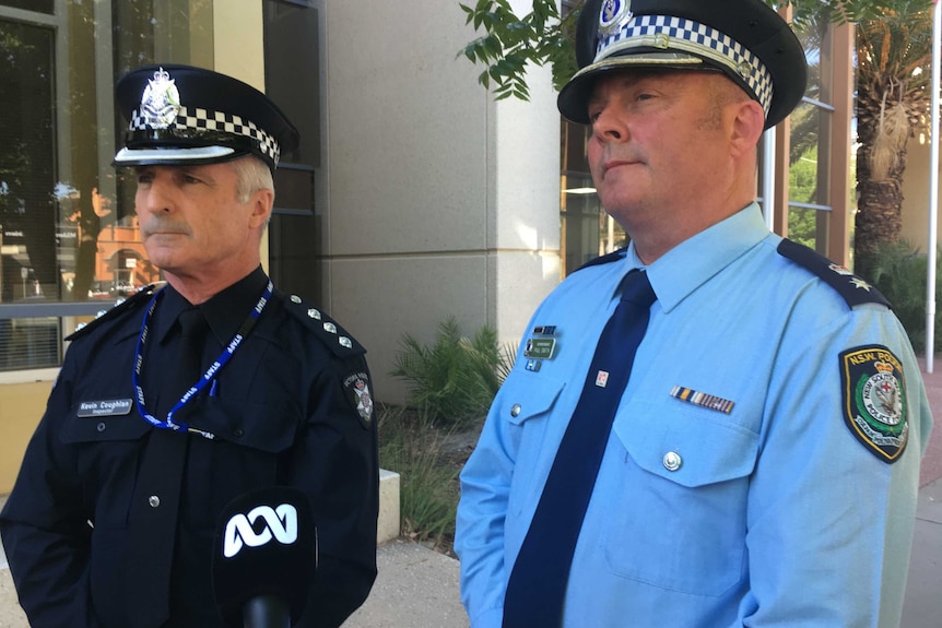 Victoria Police Inspector Kevin Coughlan (left) and Superintendent Paul Smith of New South Wales Police at a media conference.