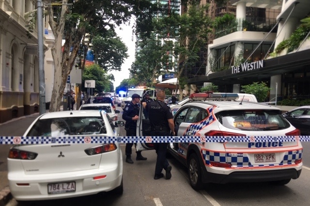 Police cordon off a city street outside a hotel