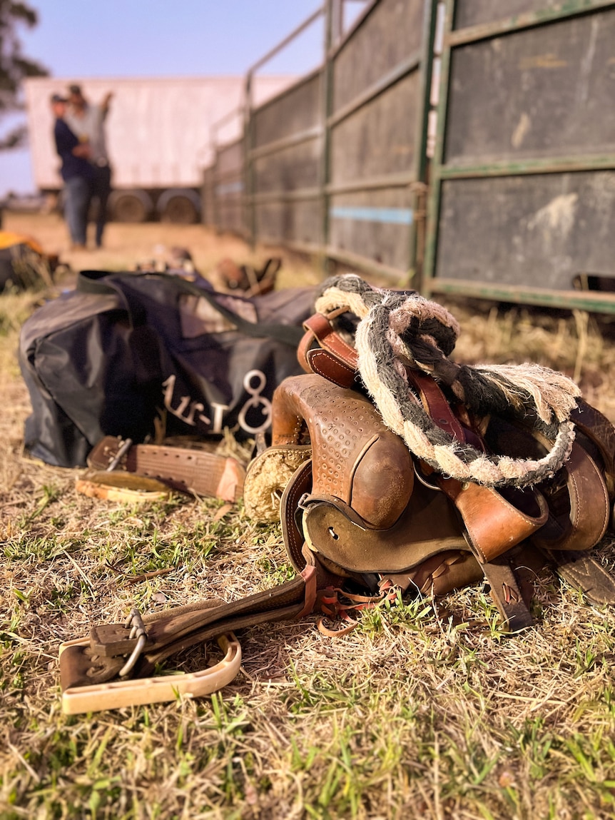 a western rodeo saddle lays on the ground Penola Rodeo