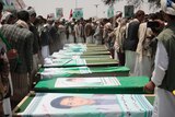 Yemeni people attend the funeral of victims of a Saudi-led airstrike