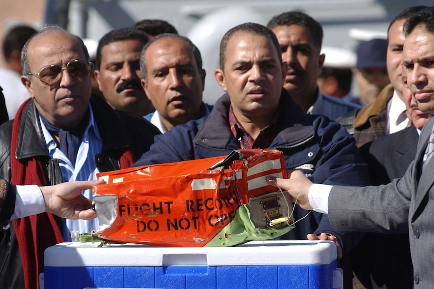 Egyptian authorities take the black box of the Flash Airlines flight that crashed off the Egyptian coast.