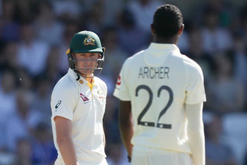 Australia batsman Marnus Labuschagne looks at England's Jofra Archer, who has his back to camera, during the third Ashes Test.