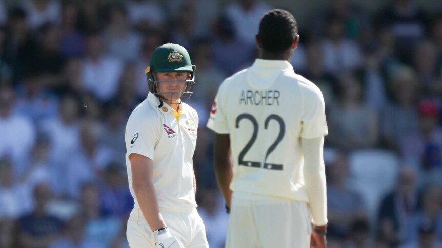 Australia batsman Marnus Labuschagne looks at England's Jofra Archer, who has his back to camera, during the third Ashes Test.
