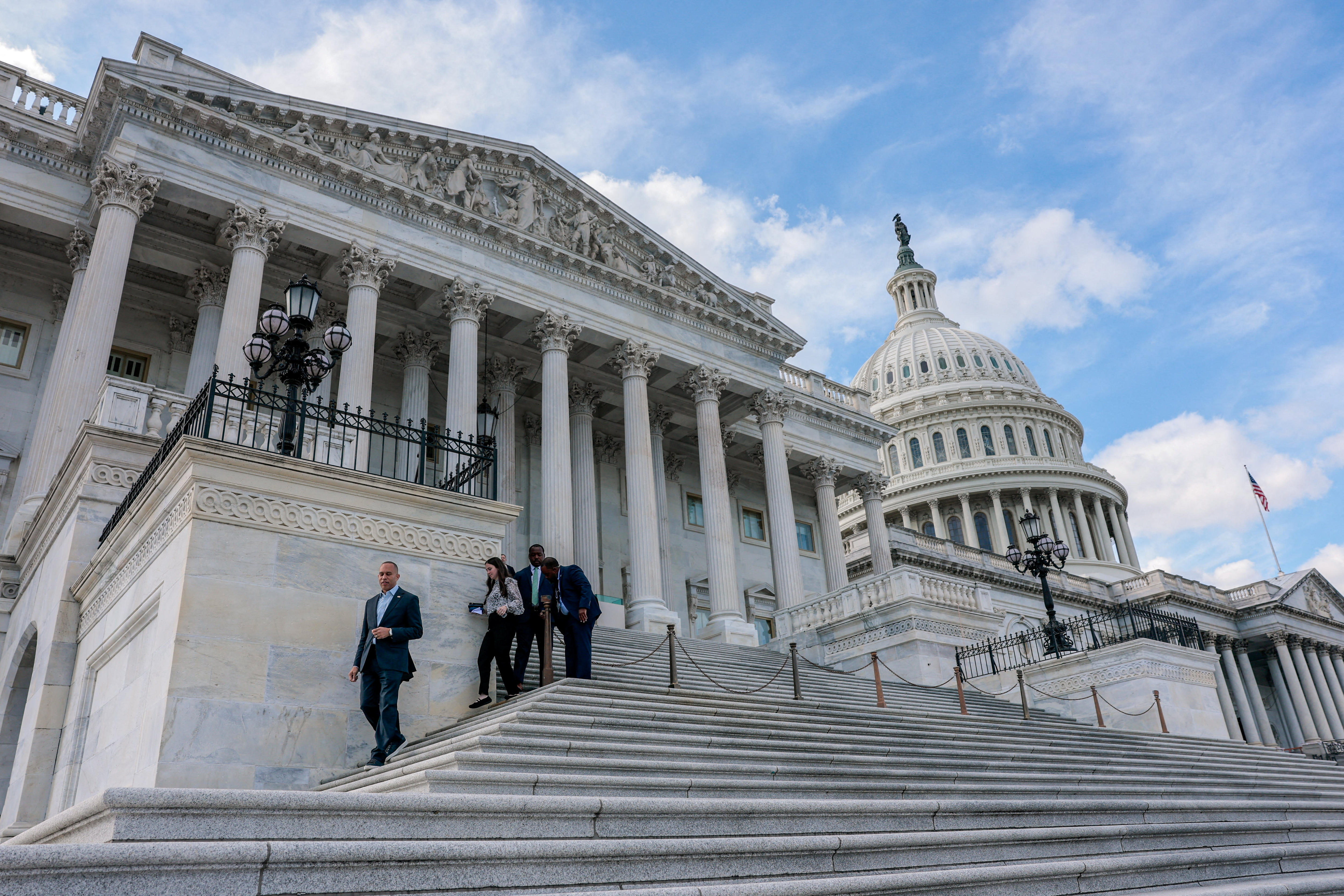 Hakeem Jeffries walks down the steps of the House of Representatives chamber on Capitol Hill