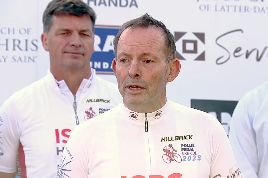 former prime minister tony abbott and angus taylor speak to the media ahead of a cycling event