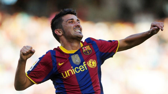Off the mark: David Villa nets on his league debut for Barcelona.