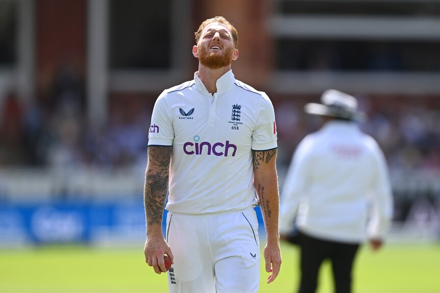 Ben Stokes grimaces and looks up