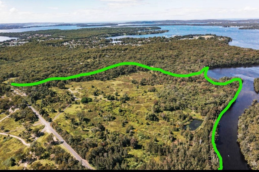 Aerial view of land next lake