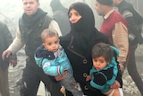 People flee after airstrikes in Aleppo, Syria