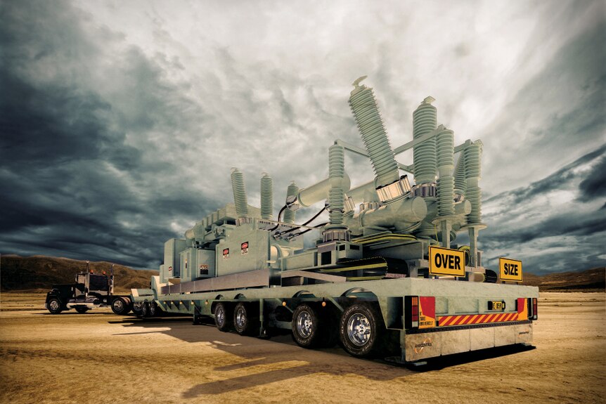 An Ampcontrol electrical transformer sits on the back of a truck with dramatic clouds in the background.