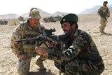 Afghan soldier taught to use rifle