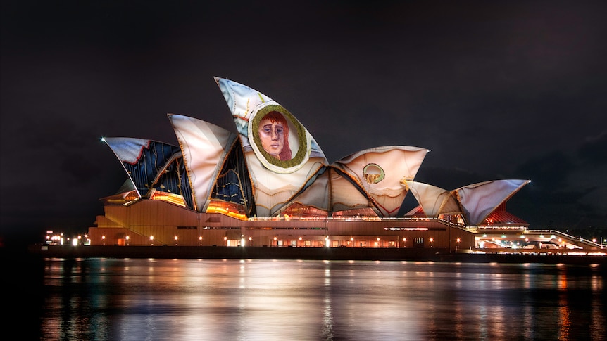 The Sydney Opera House roof sails lit up with images depicting the story of Narcissus.