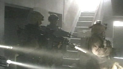 US troops raid a Fallujah apartment.