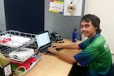 Year 12 student Travis Kennell sits at his working space with a laptop at the ready.