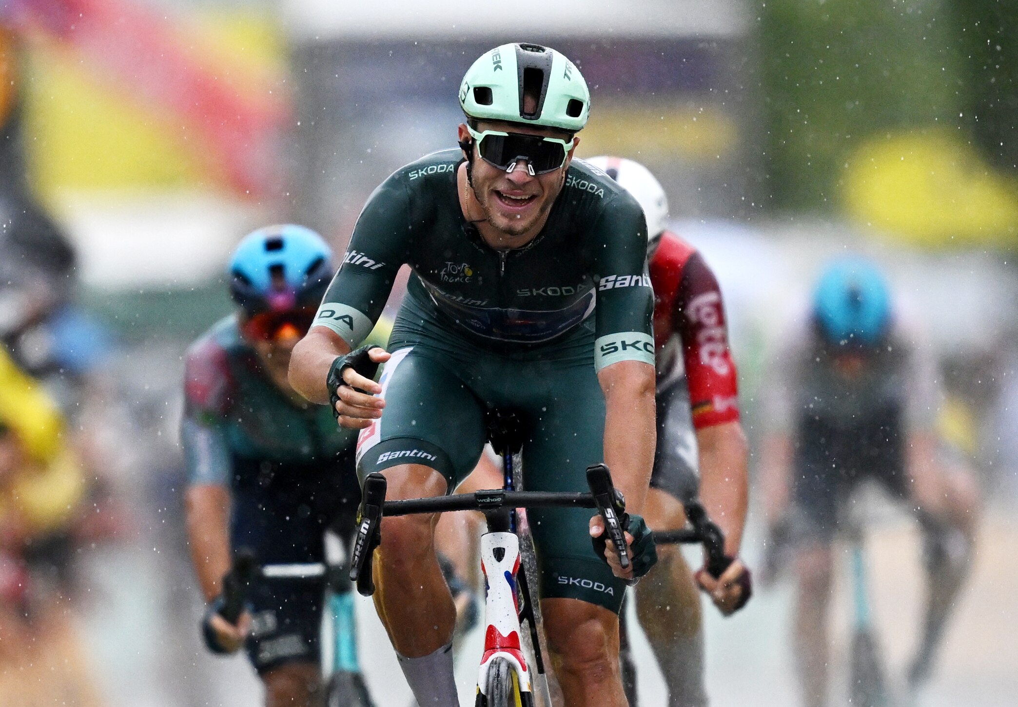 Jonathan Milan crosses the finish line after winning stage 17 of the Tour de France.