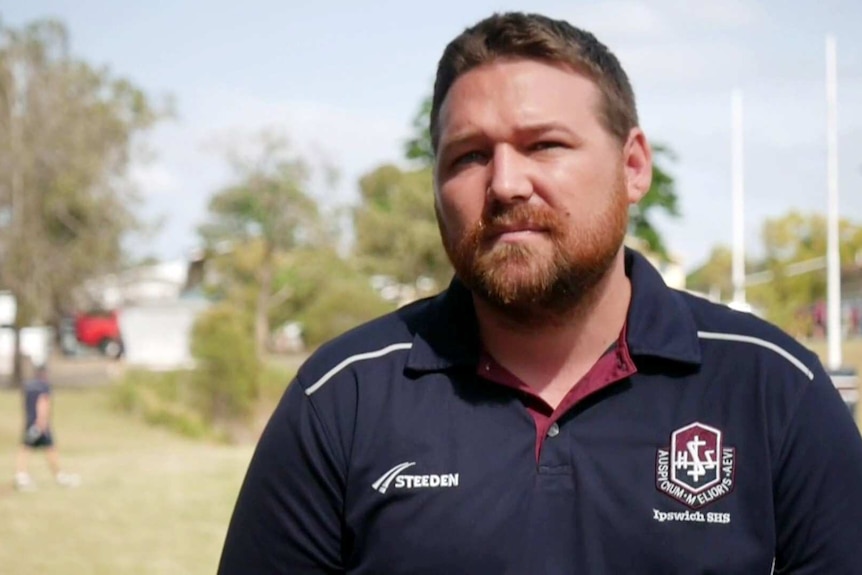 A man in a rugby jersey.