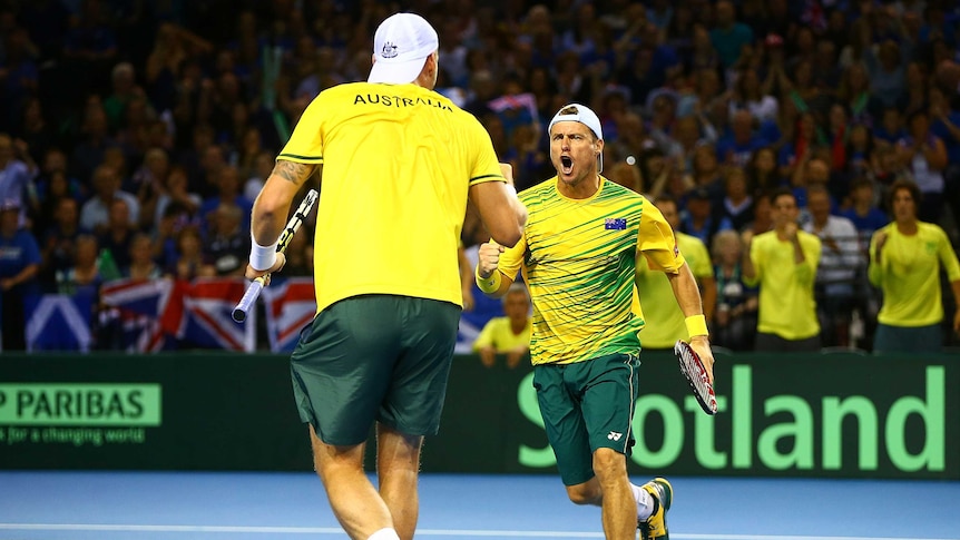 Lleyton Hewitt celebrates a point with Sam Groth in the Davis Cup