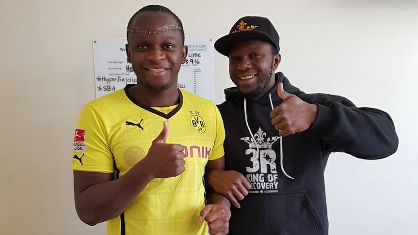 Yusuf Kamara smiles and poses with his brother.