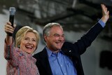 Hillary Clinton and Tim Kaine wave to crowds.