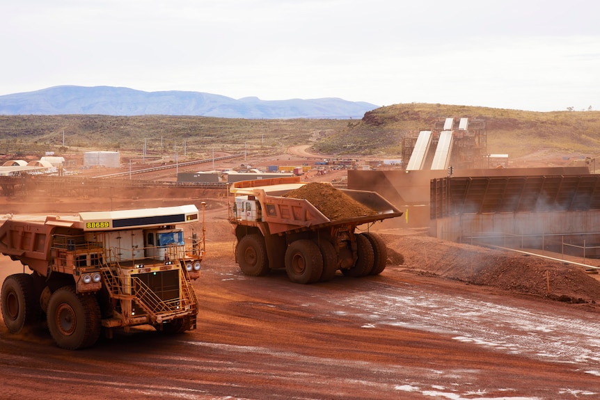 Dump trucks at work at Fortescue Metals Grou's Eliwana project in the Pilbara.