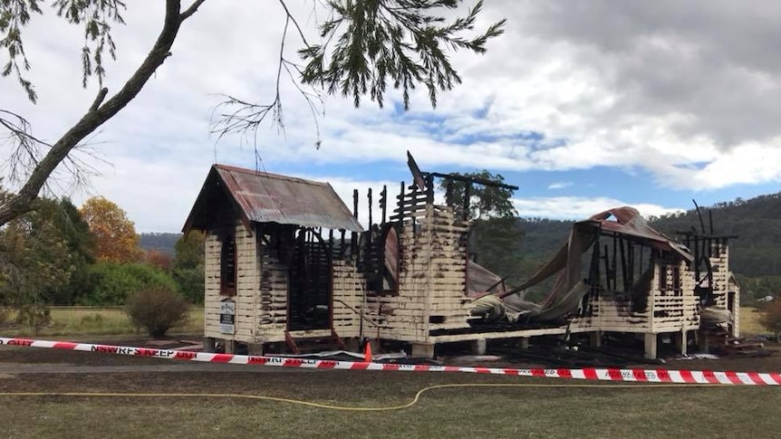 A small wooden church completely gutted by fire