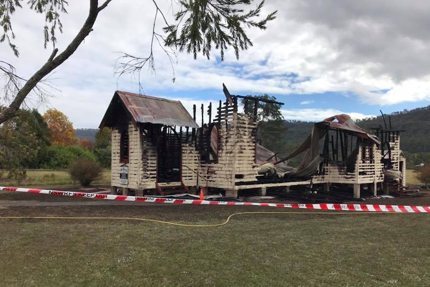 A small wooden church completely gutted by fire