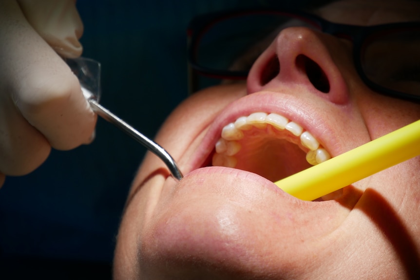 A person receiving dental treatment.