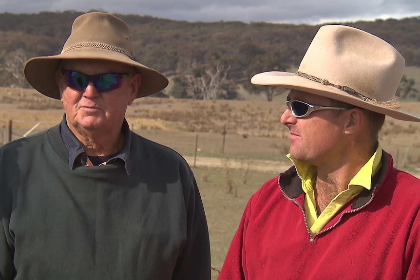 Two farmers talking about biosolids in the fields