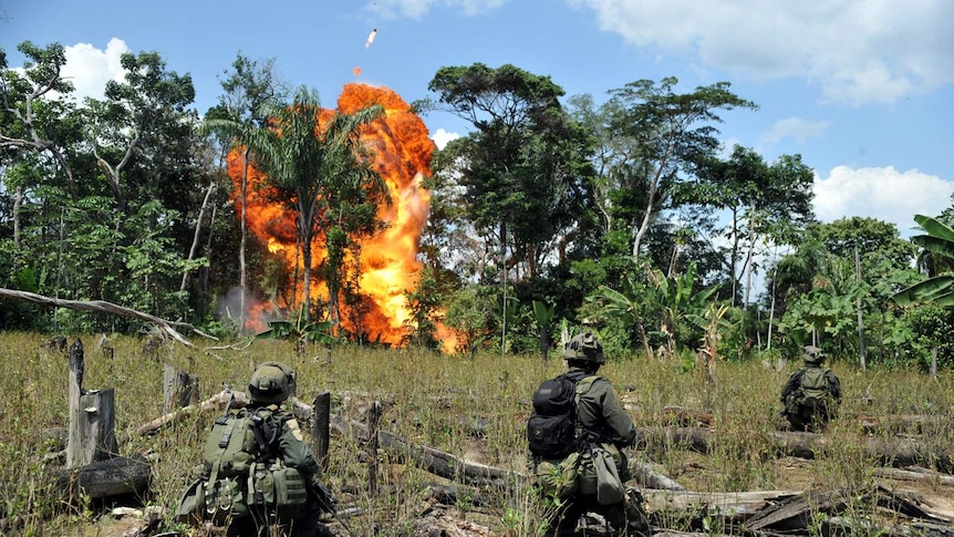 Colombian police blow up a laboratory for processing cocaine.