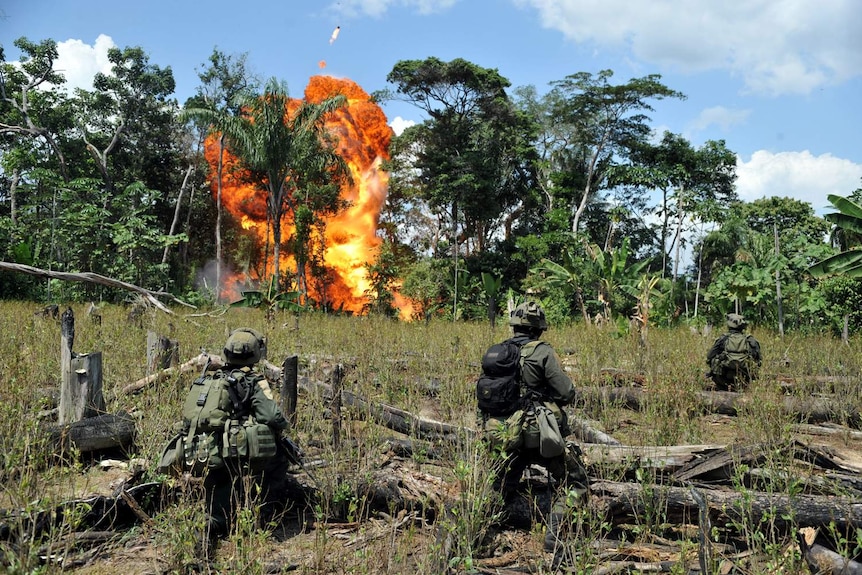 Colombian police blow up a laboratory for processing cocaine.