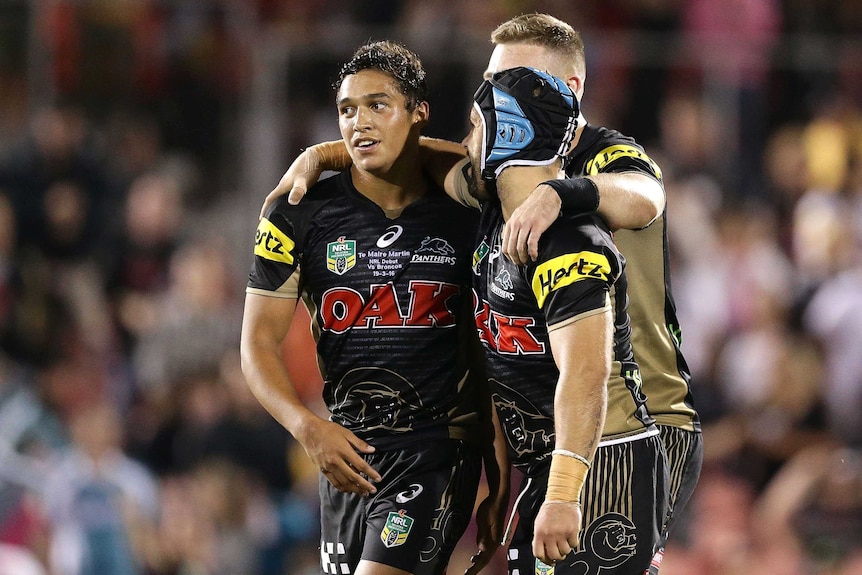 Te Maire Martin and Jamie Soward celebrate victory over the Brisbane Broncos