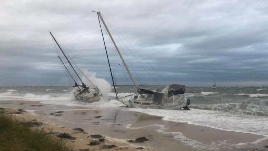 Two loose yachts wash up on a Bunbury beach after coming loose during a large storm