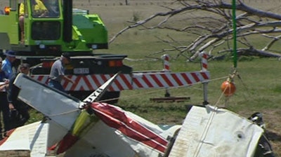 The wreckage of the plane is pulled from a dam near Ipswich in South-East Qld