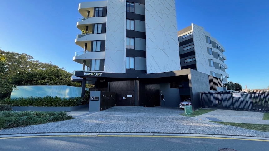 A wide shot of the Newport building during the day.