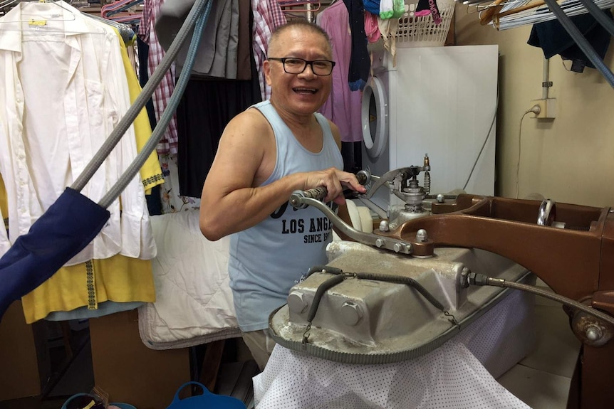 Tai Van working in his Brisbane dry cleaning business at Corinda on January 14, 2017