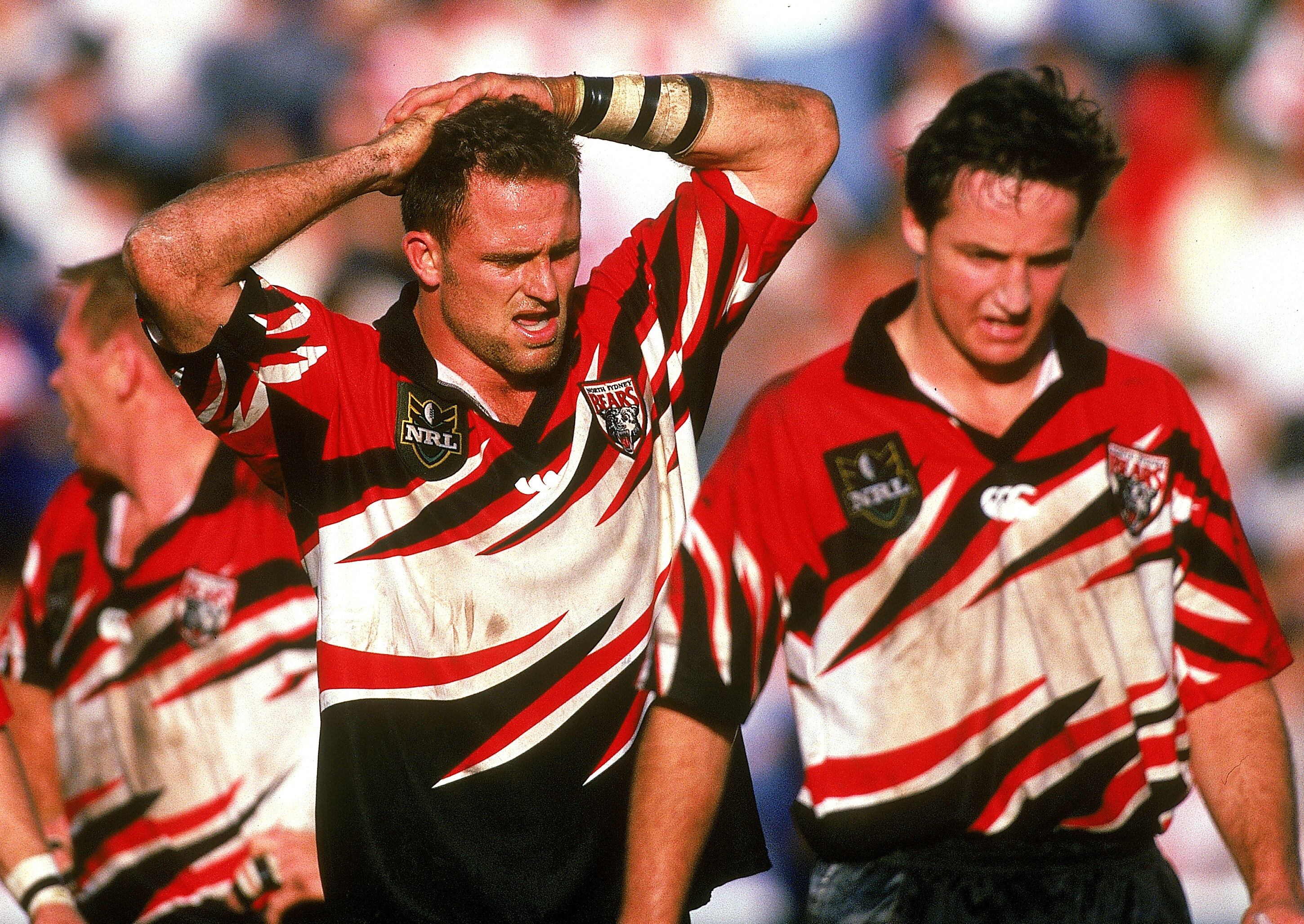 Two players look frustrated during a rugby league match