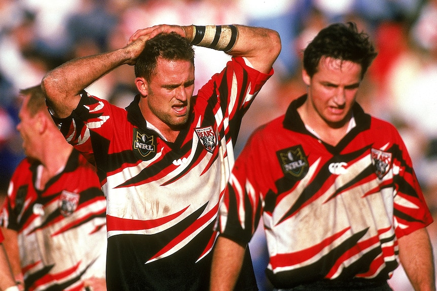 Two players look frustrated during a rugby league match