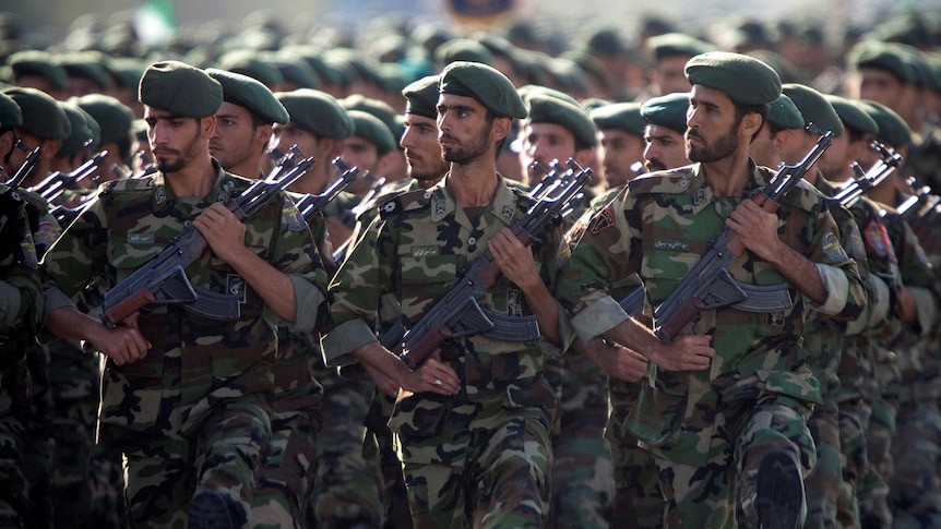 Members of Iran's Revolutionary Guards march during a military parade